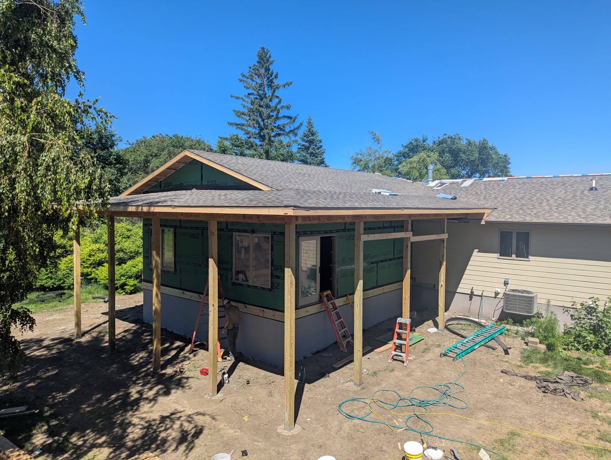 Wraparound porch addition under construction, Iroquois SD